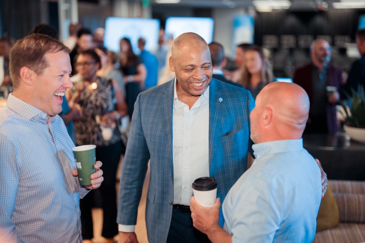 Dave Bozeman C.H. Robinson CEO speaking with colleagues.
