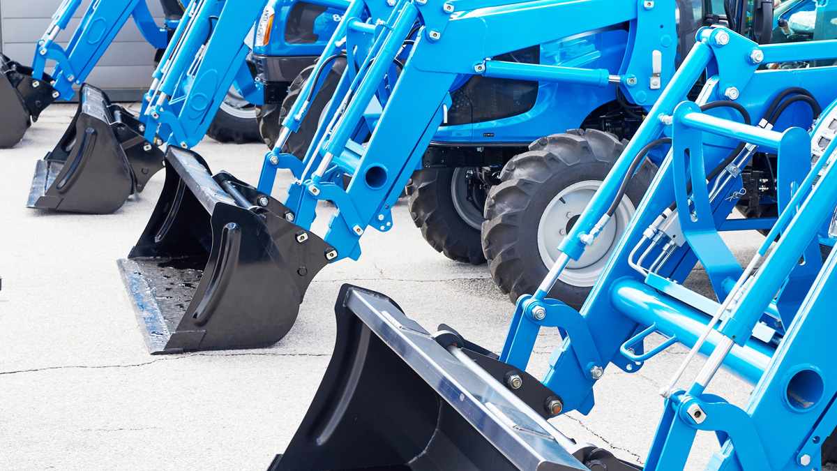 line of yellow tractors
